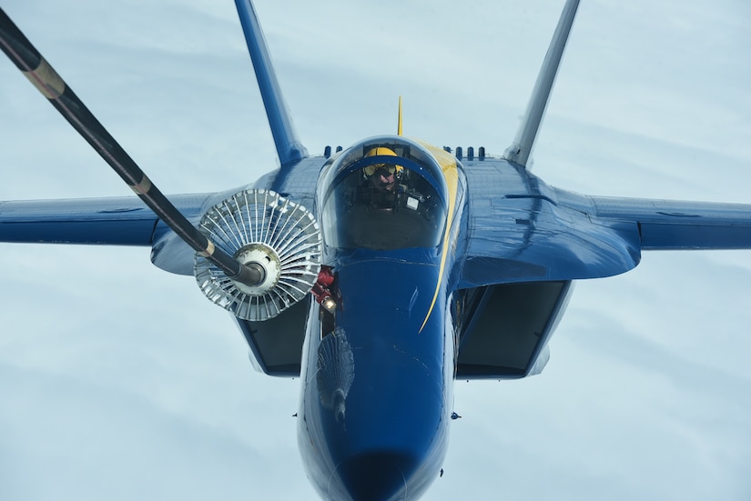 A U.S. Navy Blue Angels F/A-18 Hornet receives fuel from a KC-10 Extender assigned to Joint Base McGuire-Dix-Lakehurst, N.J., June 28, 2021. The Blue Angels needed in-flight refueling during their flight home to Florida after participating in an Air Show. (U.S. Air Force photo by Senior Airman Ariel Owings)
