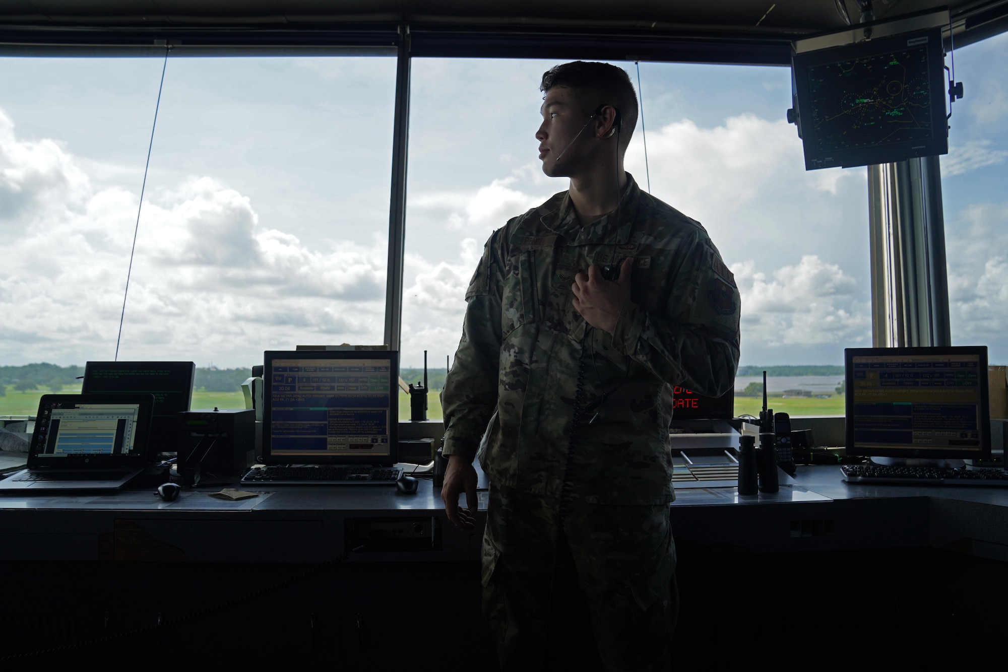 U.S. Air Force Airman 1st Class Jacob Penny, 81st Training Wing air traffic controller, poses for a photo inside the Keesler Air Traffic Control tower at Keesler Air Force Base, Mississippi, June 25, 2021. The 81st TRW Operations Support Flight traffics the aircraft on the Keesler flightline and the local airspace. (U.S. Air Force photo by Senior Airman Seth Haddix)