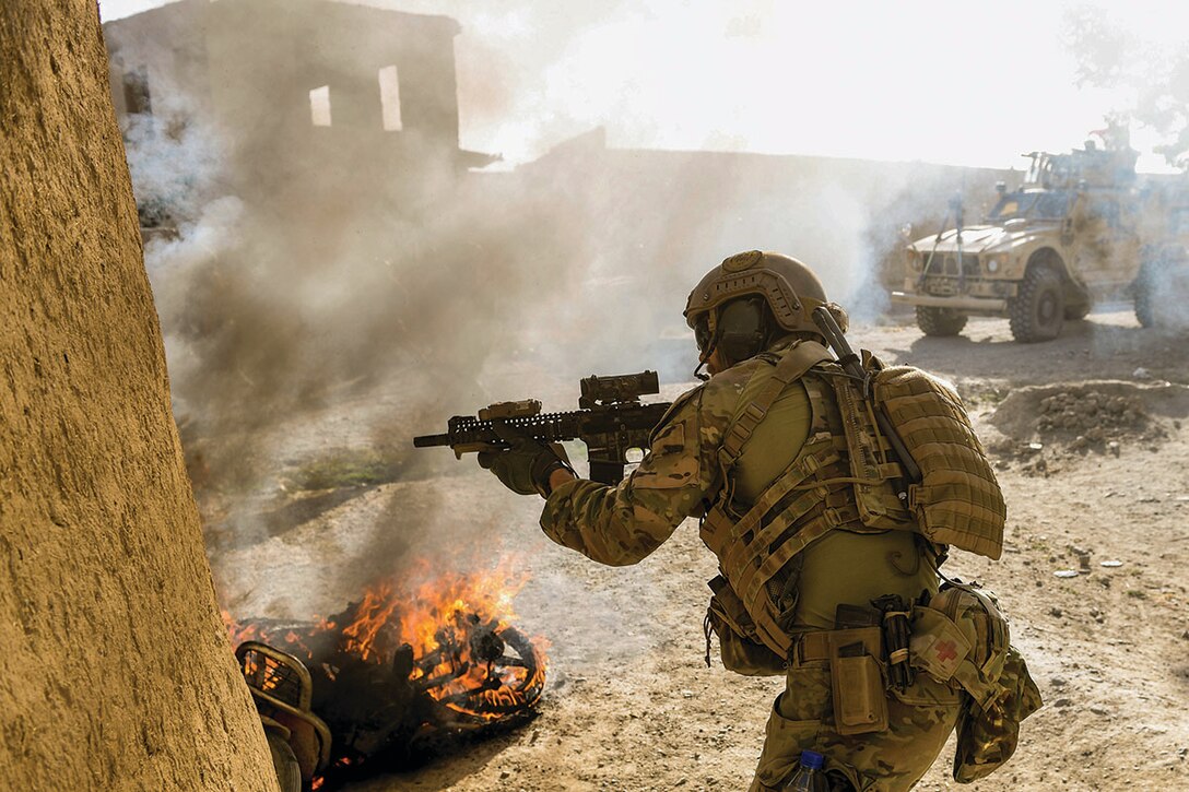 A U.S. Special Operations soldier returns fire while conducting multi-day Afghan-led offensive operations against the Taliban in Mohammad Agha district, Logar Province, Afghanistan, July 28, 2018. (U.S. Air Force photo by Staff Sgt. Nicholas Byers)