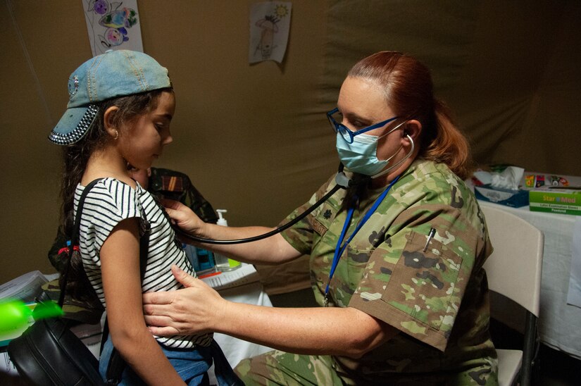 U.S. Air Force Lt. Col. Nicole Christiano, a physician with the 146th Airlift Wing, examines a pediatric patient at the Military Medical Surgical Field Hospital in Tafraoute, Morocco on June 13, 2021 during African Lion 2021.