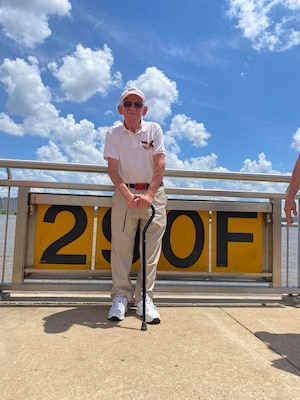 Art Denkmann retires from volunteering as a gauge reader for the St. Louis District during a ceremony on the Mississippi River in St. Louis, Mo.