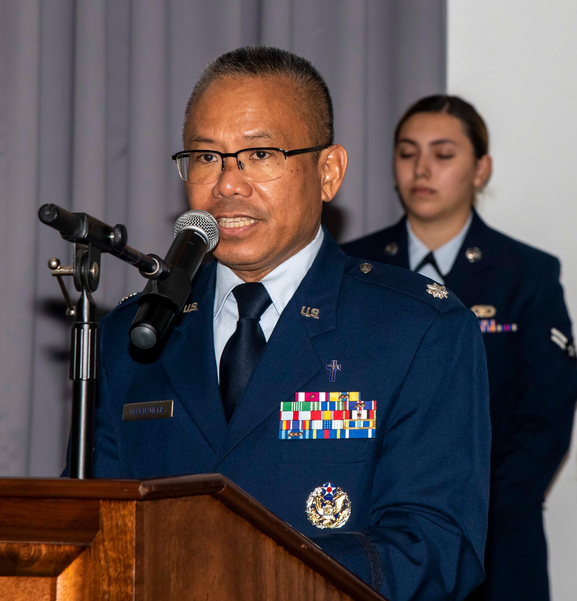 Lt. Col. Abner Valenzuela, 436th Airlift Wing chaplain, performs an invocation during the 436th Comptroller Squadron change of command ceremony on Dover Air Force Base, Delaware, June 28, 2021. The ceremony saw outgoing commander, Maj. Kevin Byram, relinquish command to Lt. Col. Gretchen Lewis. (U.S. Air Force photo by Airman 1st Class Stephani Barge)