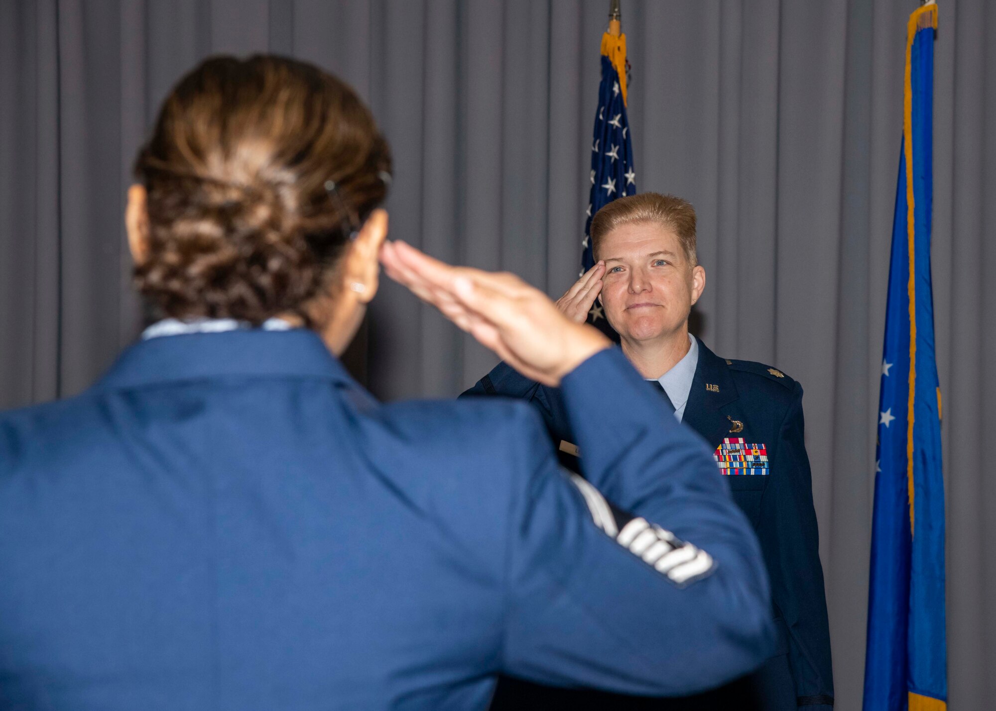 Lt. Col. Gretchen Lewis, incoming 436th Comptroller Squadron commander, returns a first salute during a change of command ceremony on Dover Air Force Base, Delaware, June 28, 2021. The ceremony saw Maj. Kevin Byram relinquish command to Lewis. (U.S. Air Force photo by Airman 1st Class Stephani Barge)