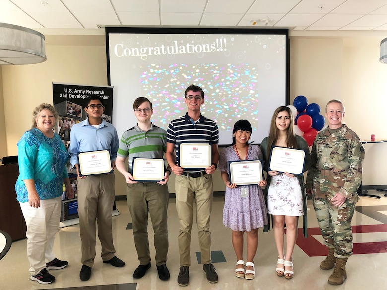 ERDC Alumni Association President Julie Marcy and ERDC Commander Col. Teresa Schlosser are pictured with five recent high-school graduates, Saatvik Agrawal, Benjamin Talbot, Scott Wallace, Anna Lamanilao and Alana Latorre, who were awarded scholarships from the Alumni Association.