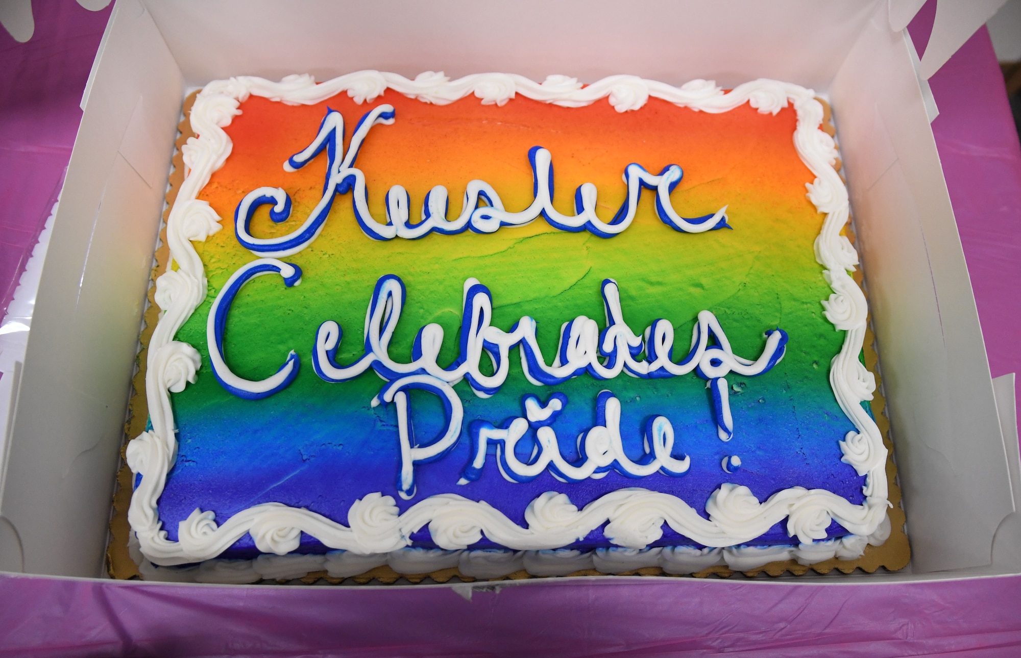 A cake is on display during the LGBTQ+ Informational Expo inside the Roberts Consolidated Aircraft Maintenance Facility at Keesler Air Force Base, Mississippi, June 25, 2021. Keesler celebrated Pride Month throughout June, with events such as a scavenger hunt, guest speaker and discussion panel. (U.S. Air Force photo by Kemberly Groue)
