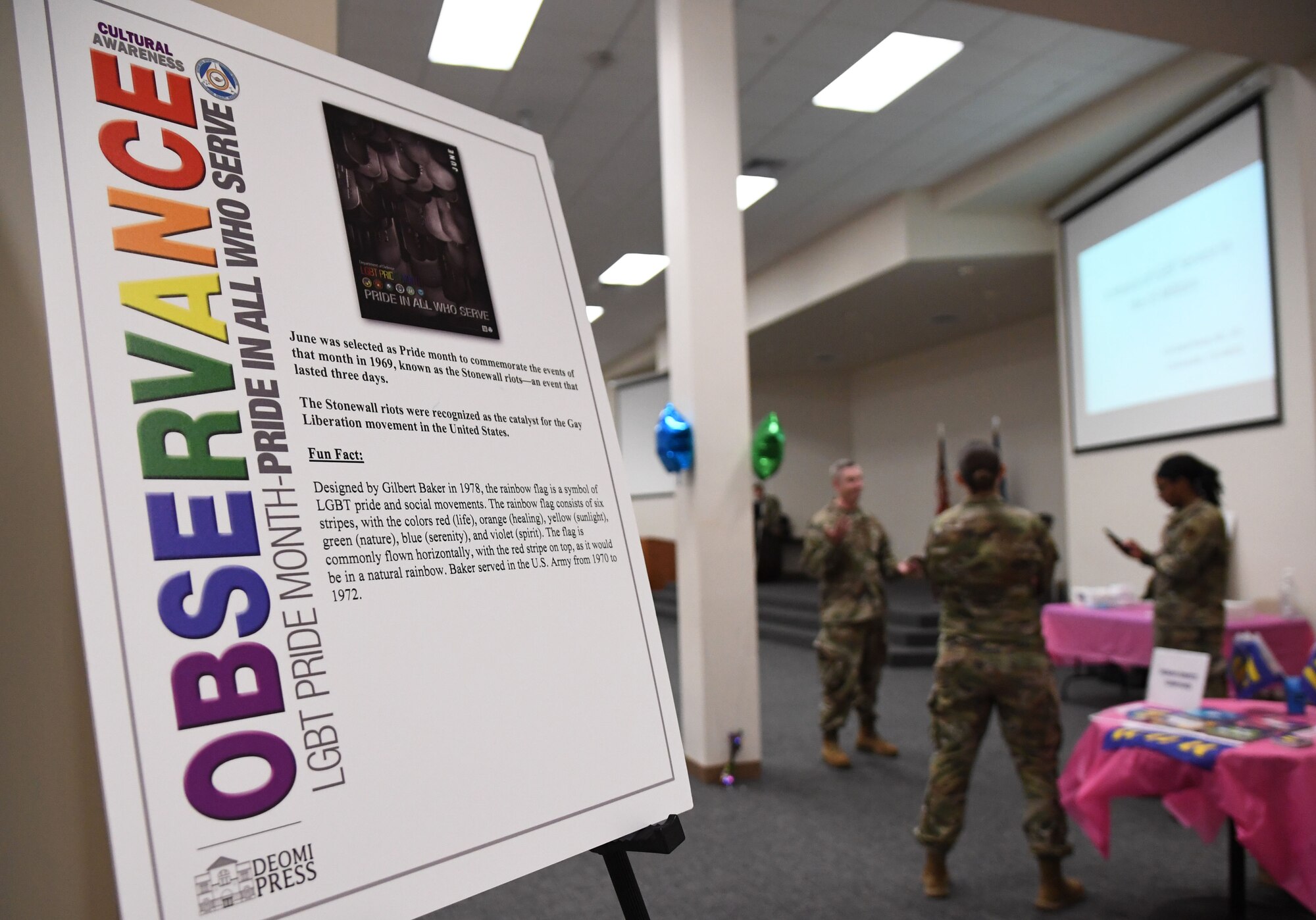 A poster is on display during the LGBTQ+ Informational Expo inside the Roberts Consolidated Aircraft Maintenance Facility at Keesler Air Force Base, Mississippi, June 25, 2021. Keesler celebrated Pride Month throughout June, with events such as a scavenger hunt, guest speaker and discussion panel. (U.S. Air Force photo by Kemberly Groue)