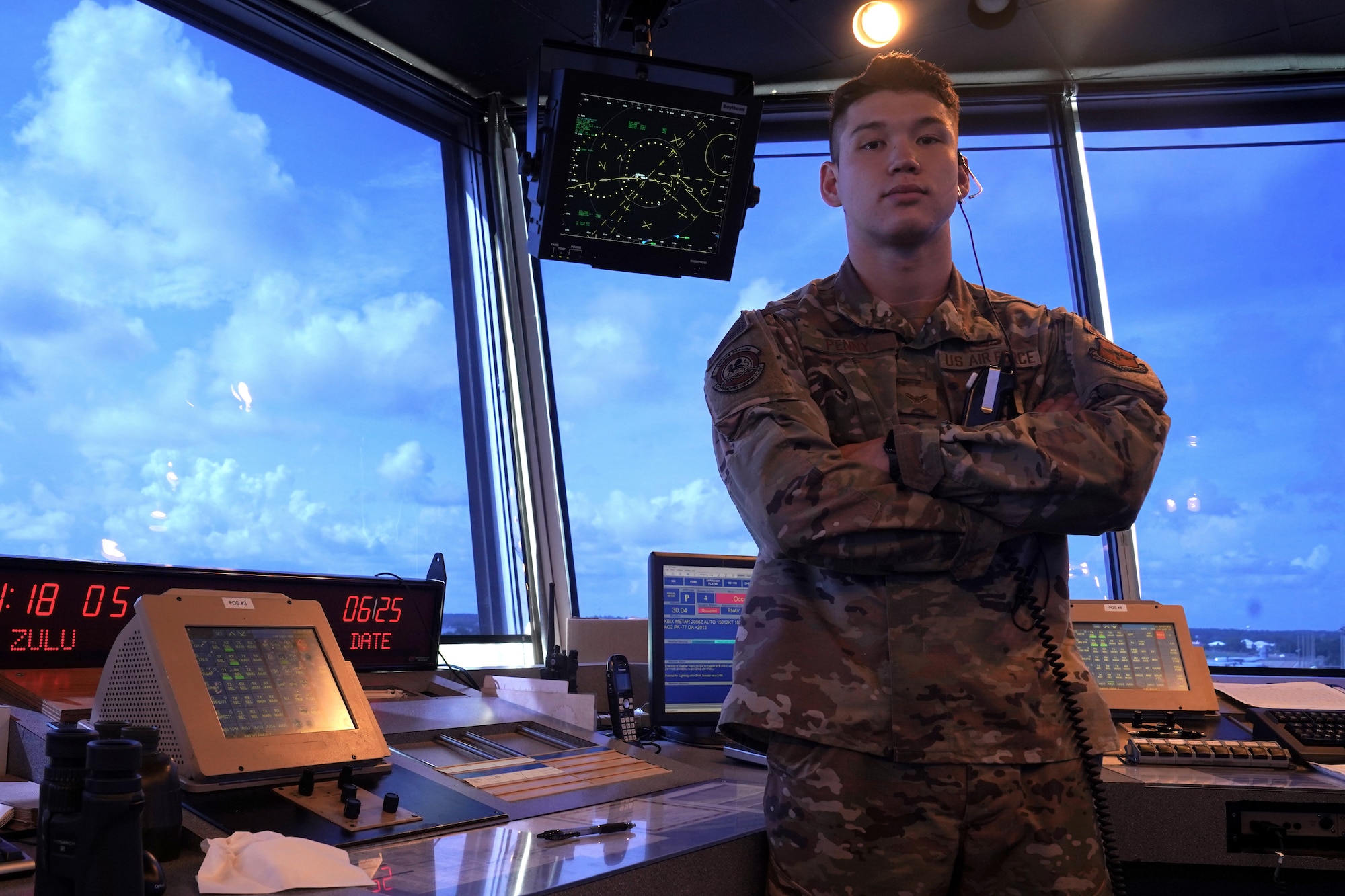 U.S. Air Force Airman 1st Class Jacob Penny, 81st Training Wing air traffic controller, poses for a photo inside the Keesler Air Traffic Control tower at Keesler Air Force Base, Mississippi, June 25, 2021. The 81st TRW Operations Support Flight traffics the aircraft on the Keesler flightline and the local airspace. (U.S. Air Force photo by Senior Airman Seth Haddix)