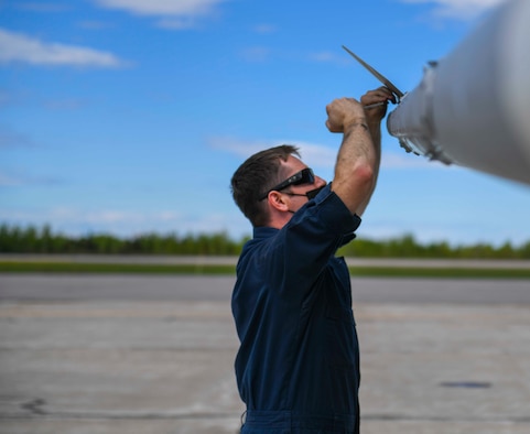 A U.S. Air Force Airman from the 140th Aircraft Maintenance Squadron removes weapons from an F-16 Fighting Falcon during exercise Amalgam Dart 21-01 in Goose Bay, Canada, June 14, 2021. Exercise Amalgam Dart will run from June 10-19, 2021, with operations ranging across the Arctic from the Beaufort Sea to Thule, Greenland. Amalgam Dart 21-01 provides NORAD the opportunity to hone continental defense skills as Canadian and U.S. forces operate together in the Arctic. A bi-national Canadian and American command, NORAD employs a network of space-based, aerial and ground-based sensors, air-to-air refueling tankers, and fighter aircraft, controlled by a sophisticated command and control network to deter, deny and defeat aerospace threats that originate outside or within our borders. (U.S. Air Force photo by Airman 1st Class Kiaundra Miller)