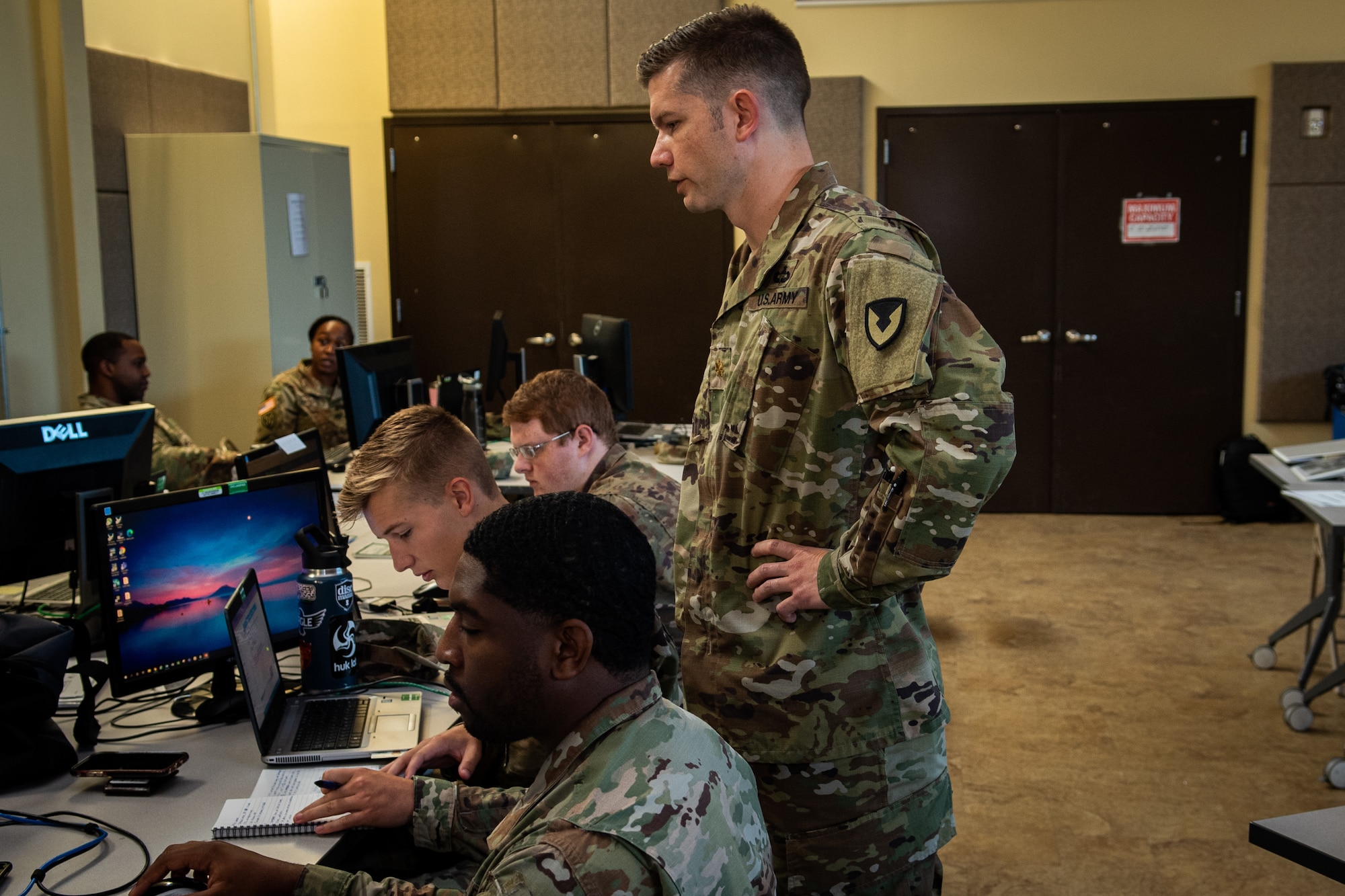 Maj. Matthew Szarzynski watches Airmen and Soldiers