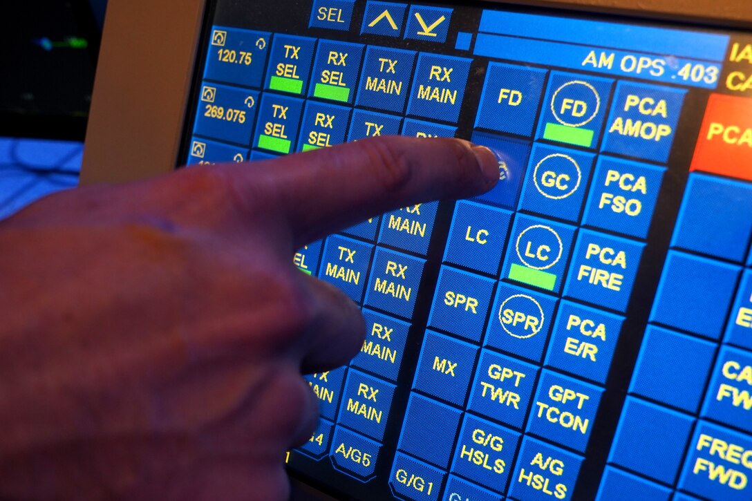 U.S. Air Force Staff Sgt. Brandon Ahuna, 81st Training Wing Operations Support Flight tower watch supervisor, works on an interactive touch screen inside the Keesler Air Traffic Control tower at Keesler Air Force Base, Mississippi, June 25, 2021. The 81st TRW OSF traffics the aircraft on the Keesler flightline and the local airspace. (U.S. Air Force photo by Senior Airman Seth Haddix)