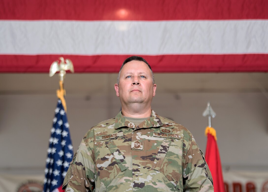 Chief Master Sgt. James Tongate stands at attention to accept his new role as state command chief of the Kentucky Air National Guard during a ceremony at the Kentucky Air National Guard Base in Louisville, Ky., May 15, 2021. Tongate previously served as human resource advisor for the 123rd Airlift Wing. (U.S. Air National Guard photo by Senior Airman Chloe Ochs)