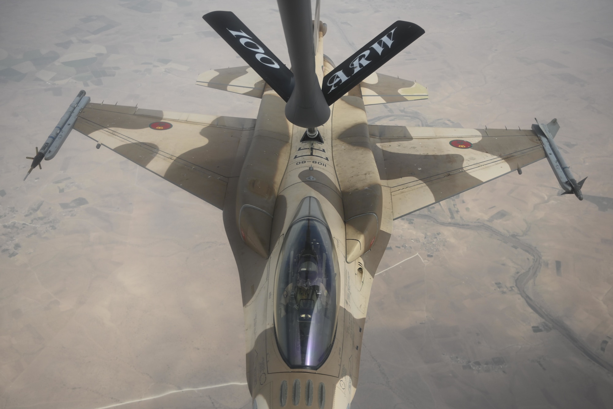 A Royal Moroccan Air Force  F-16 Fighting Falcon aircraft refuels with a U.S. Air Force KC-135 Stratotanker aircraft over Morocco during Exercise African Lion 2021, June 15, 2021. Conducting air refueling training with our partners is critical because the capability provides a “bridge” that allows the expeditionary Air Force to deploy around the globe at a moment’s notice.



African Lion is U.S. Africa Command's largest, premier, joint, annual exercise hosted by Morocco, Tunisia and Senegal, 7-18 June. More than 7,000 participants from nine nations and NATO train together with a focus on enhancing readiness for U.S. and partner nation forces. African Lion is a multi-domain, multi-component, and multi-national exercise, which employs a full array of mission capabilities with the goal to strengthen interoperability among participants. (U.S. Air Force photo by Senior Airman Joseph Barron)