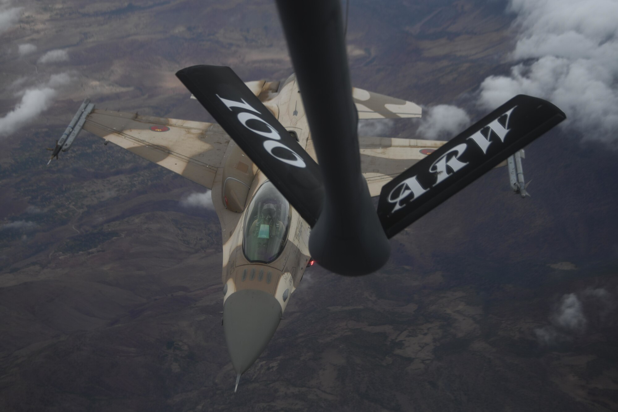 A Royal Moroccan Air Force F-16 Fighting Falcon aircraft approaches a U.S. Air Force KC-135 Stratotanker aircraft assigned to the 100th Air Refueling Wing to conduct air refueling over Morocco during Exercise African Lion 2021, June 18, 2021. Air refueling training strengthens defense capabilities to serve U.S. and African partner nations.



African Lion is U.S. Africa Command's largest, premier, joint, annual exercise hosted by Morocco, Tunisia and Senegal, 7-18 June. More than 7,000 participants from nine nations and NATO train together with a focus on enhancing readiness for U.S. and partner nation forces. African Lion is a multi-domain, multi-component, and multi-national exercise, which employs a full array of mission capabilities with the goal to strengthen interoperability among participants. (U.S. Air Force photo by Senior Airman Joseph Barron)