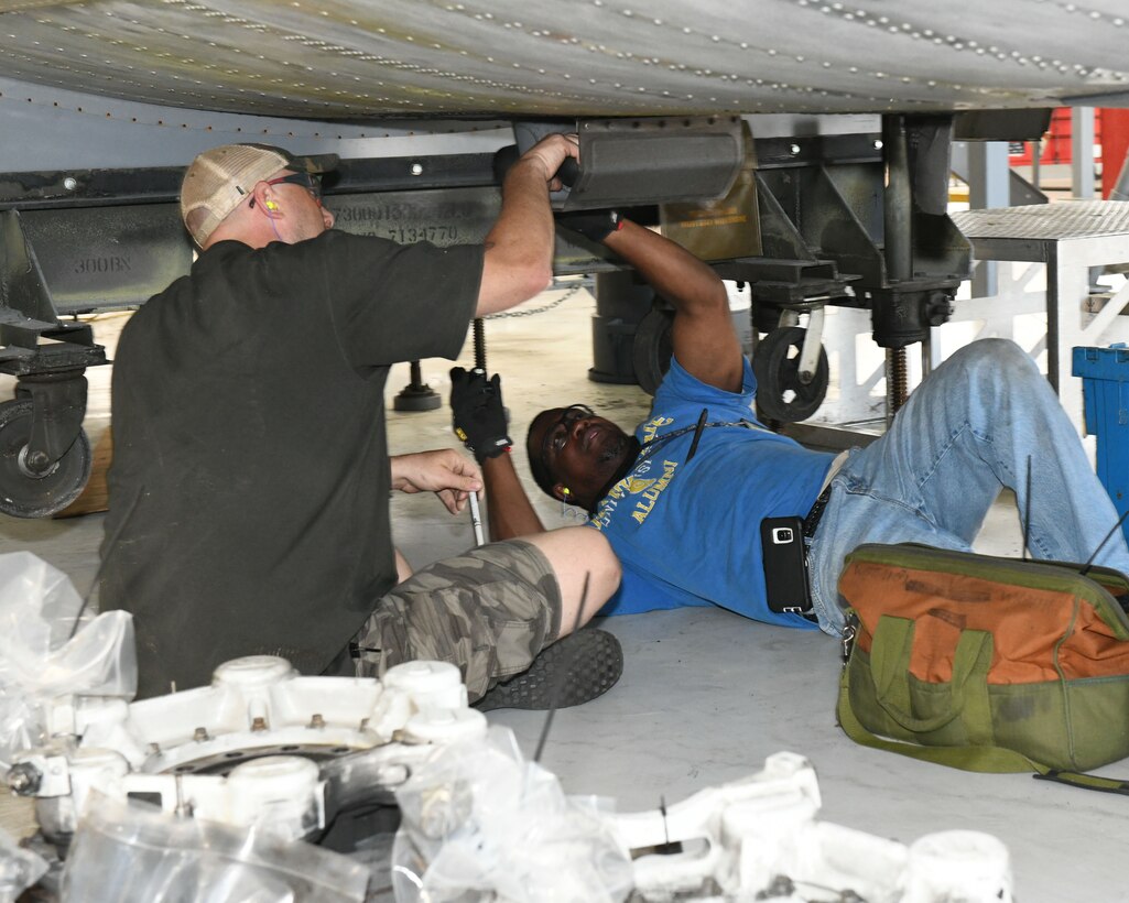 mechanics working on an airplane