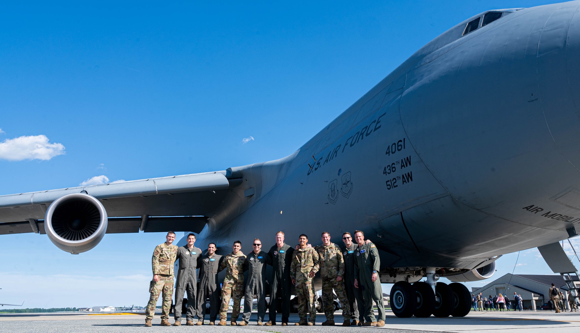 Airmen from the 9th Airlift Squadron pose in front of a C-5M Super Galaxy to commemorate the final flight of 3Lt. Col. John Habbestad, 9th AS commander, at Dover Air Force Base, Delaware, June 23, 2021. Habbestad served as commander for two years. (U.S. Air Force photo by Senior Airman Faith Schaefer)