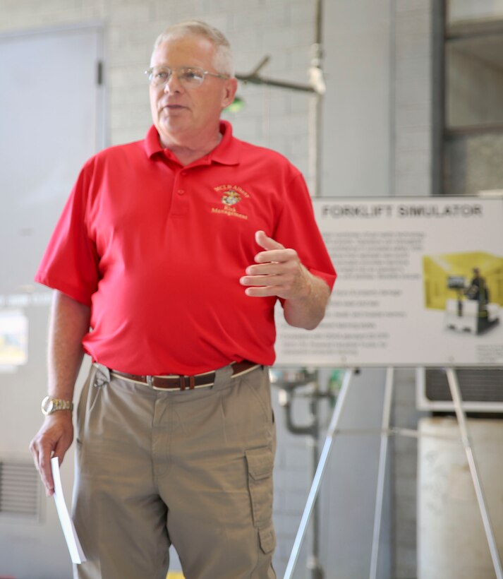 A new forklift simulator, complete with virtual reality goggles and a two-sided screen, allows for those in forklift training aboard Marine Corps Logistics Base Albany to see what they would see – and perform the same maneuvers – as if they were on a real forklift. Now in a dedicated space in the base’s Garrison Mobile Equipment branch, it provides a way to train forklift drivers with an added layer of safety. The ribbon was cut on the investment June 25. (U.S. Marine Corps photos by Jennifer Parks)