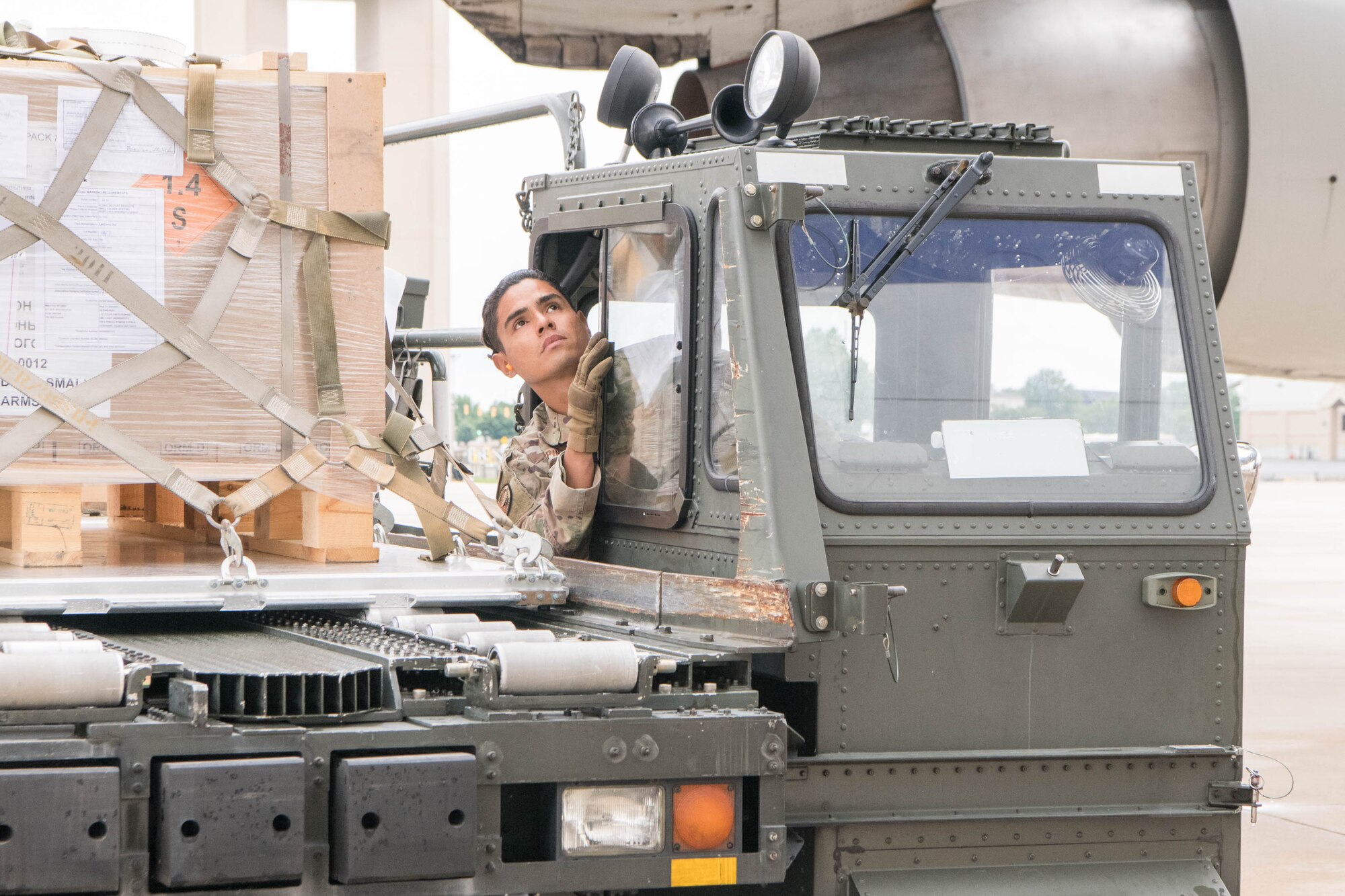 Staff Sgt. Manuel Espino, 436th Aerial Port Squadron ramp services supervisor, positions a K-loader next to an aircraft bound for Ukraine at Dover Air Force Base, Delaware, June 22, 2021. Team Dover Airmen loaded pallets of materiel as part of a security assistance mission to Ukraine. Missions like this demonstrate the U.S. commitment to Ukraine’s independence, sovereignty and territorial integrity. (U.S. Air Force photo by Mauricio Campino)