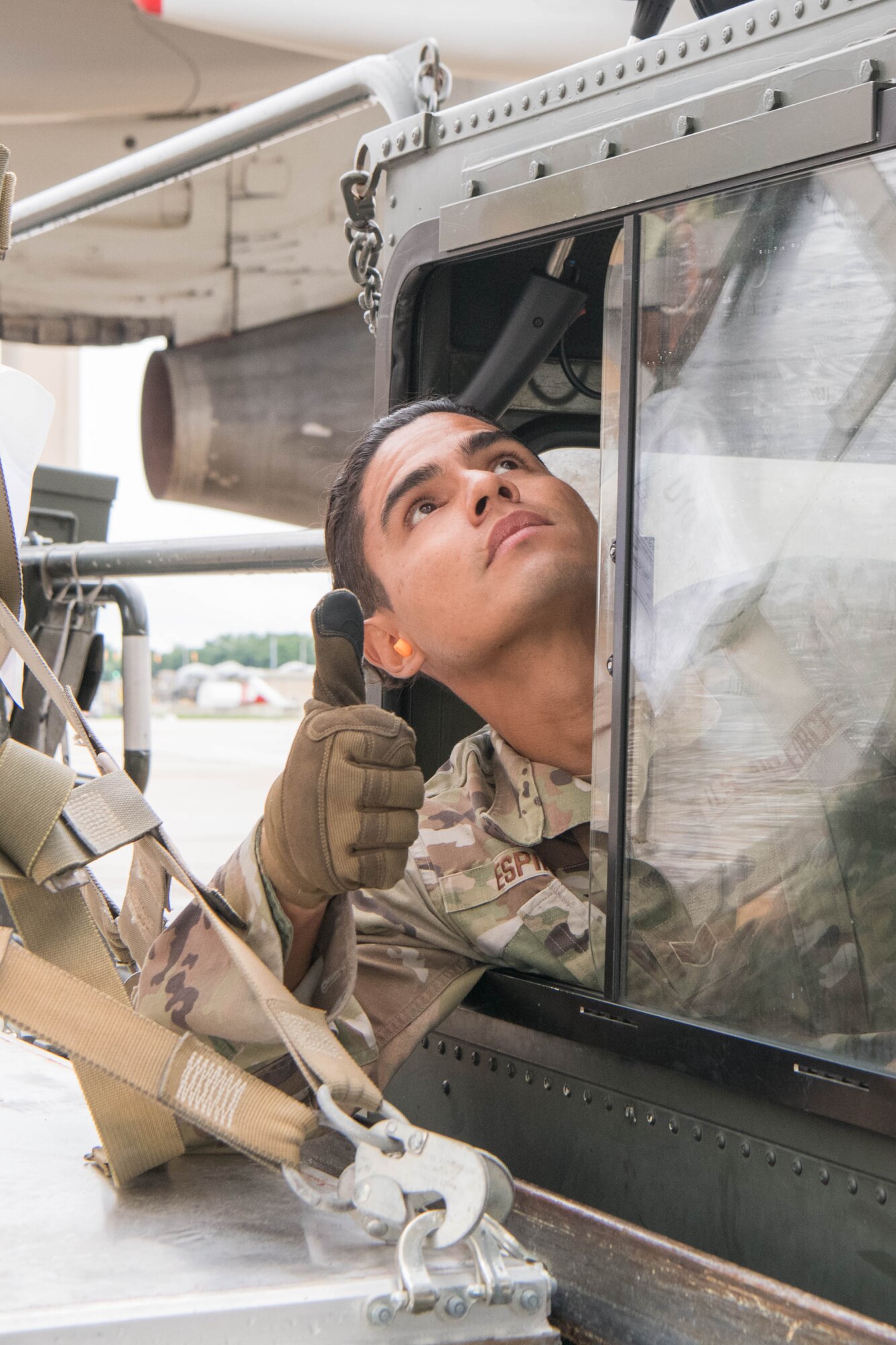 Staff Sgt. Manuel Espino, 436th Aerial Port Squadron ramp services supervisor, raises a K-loader up to an aircraft bound for Ukraine at Dover Air Force Base, Delaware, June 22, 2021. Missions like this demonstrate the U.S. commitment to Ukraine’s independence, sovereignty and territorial integrity.  (U.S. Air Force photo by Mauricio Campino)