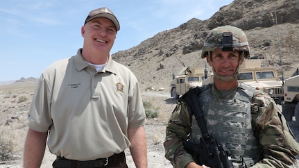 Chief Justin J. Shirley, Chief of law enforcement for the Utah Department of Wildlife Resources, and Sgt. 1st Class Dennis Shumway with the 118th Transportation Company of the 204th Maneuver Enhancement Brigade, participate in an interview at Dugway Proving Ground, Utah, June 16, 2021.