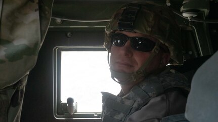 Chief Justin J. Shirley, chief of law enforcement for the Utah Department of Wildlife Resources, watches a vehicle gunner fire during gunnery training on Dugway Proving Ground, Utah, June 16, 2021.