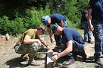 (June 23, 2021) Explosive Ordnance Disposal Technician 2nd Class Austin Setzer, assigned to Explosive Ordnance Disposal Mobile Unit 6, and Croatian divers practice detonator build ups for a 2021 Humanitarian Mine Action certification training event, June 23, 2021. U.S. Sixth Fleet, headquartered in Naples, Italy, conducts the full spectrum of joint and naval operations, often in concert with allied, joint, and interagency partners, in order to advance U.S. national interests and security and stability in Europe and Africa.
