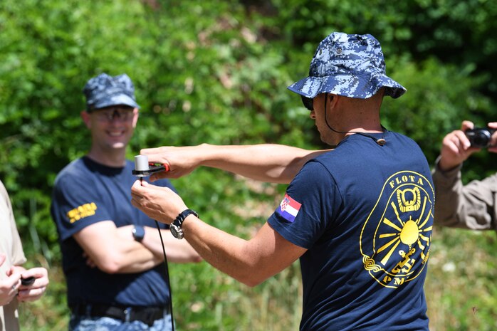 (June 23, 2021) Croatian divers practice detonator build ups for a 2021 Humanitarian Mine Action certification training event under the supervision of U.S. Navy Sailors from Explosive Ordnance Disposal Mobile Unit 6 and 8,  June 23, 2021. U.S. Sixth Fleet, headquartered in Naples, Italy, conducts the full spectrum of joint and naval operations, often in concert with allied, joint, and interagency partners, in order to advance U.S. national interests and security and stability in Europe and Africa.