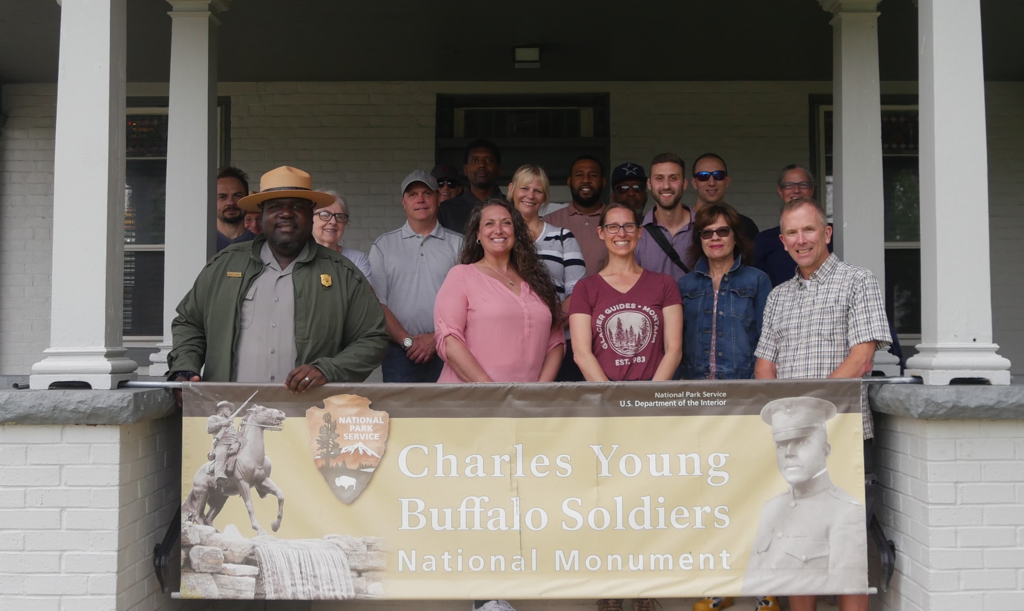 Robert Stewart, Superintendent of the Charles Young Buffalo Soldiers National Monument (front row, far left), poses in front of Young’s home with the AFRL tour group. The tour was a special going-away gift for Col. Michael Warner, (front row, far right). (U.S. Air Force photo/Spencer Deer)