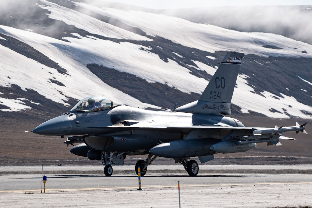 A U.S. Air Force F-16 Fighting Falcon fighter jet taxies to the ramp at Thule Air Base, Greenland, during Exercise Amalgam Dart, June 12, 2021.