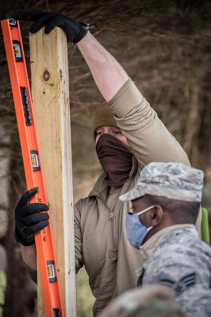 An Airman from the Kentucky Air National Guard’s 123rd Civil Engineer Squadron gets hands-on-training while helping improve infrastructure at the Active Heroes Retreat Center for veterans in Shepherdsville, Ky., Nov. 14, 2020. The Airman and dozens of others were wrapping up six months of effort at the facility, whose mission is to reduce veteran suicides. The engineers conducted grading and drainage work, repaired generators, installed fencing and performed carpentry work at the site’s 6,000-square-foot pavilion, among other tasks. The project was part of a cooperative effort between the Department of Defense and Active Heroes. (U.S. Air National Guard photos by Dale Greer)