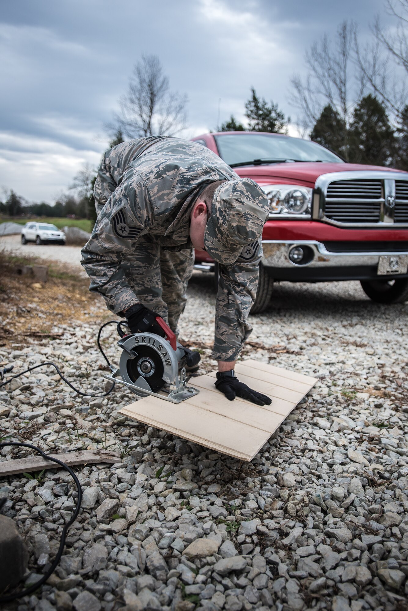 An Airman from the Kentucky Air National Guard’s 123rd Civil Engineer Squadron gets hands-on-training while helping improve infrastructure at the Active Heroes Retreat Center for veterans in Shepherdsville, Ky., Nov. 14, 2020. The Airman and dozens of others were wrapping up six months of effort at the facility, whose mission is to reduce veteran suicides. The engineers conducted grading and drainage work, repaired generators, installed fencing and performed carpentry work at the site’s 6,000-square-foot pavilion, among other tasks. The project was part of a cooperative effort between the Department of Defense and Active Heroes. (U.S. Air National Guard photos by Dale Greer)