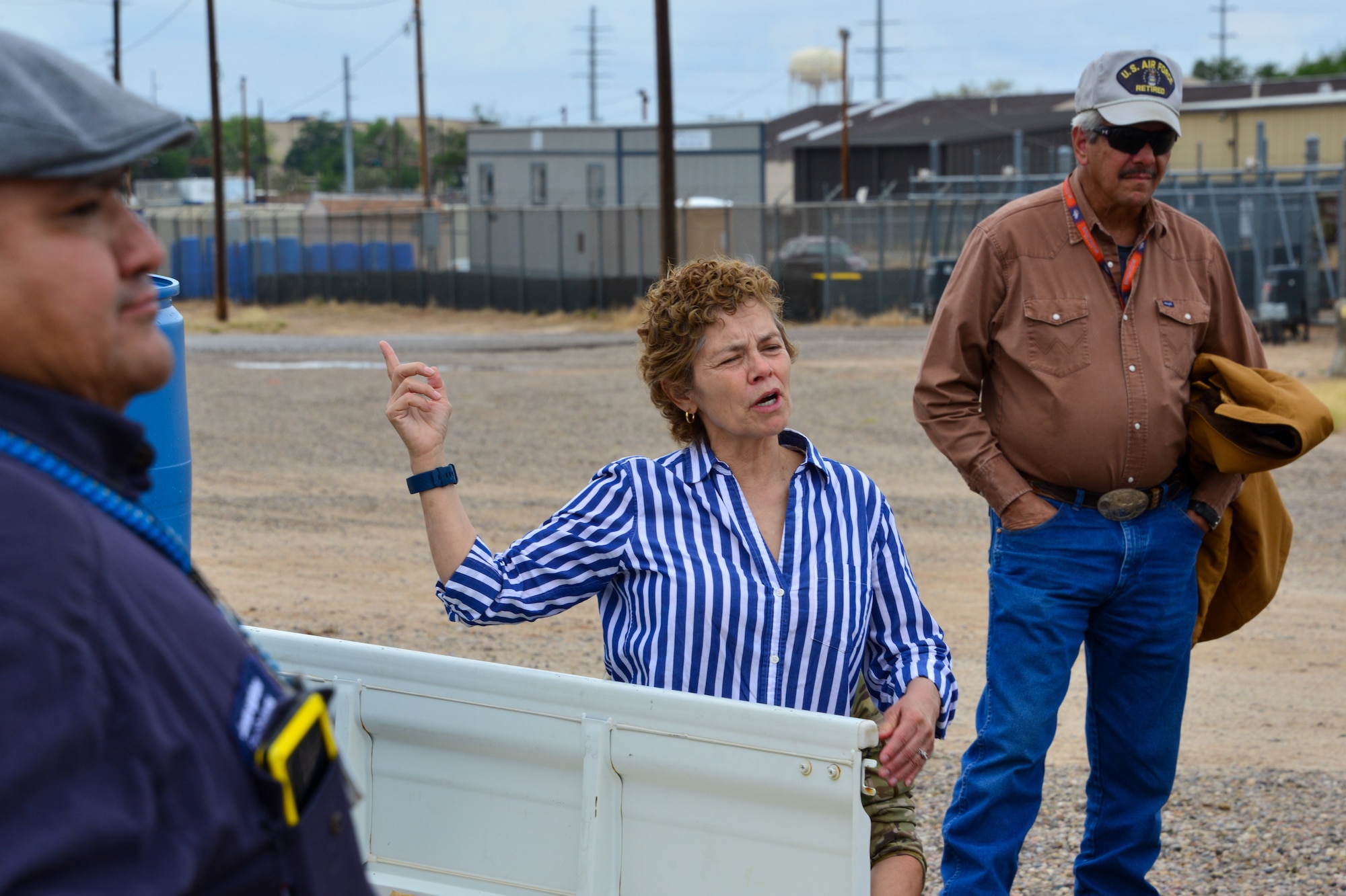 Lady explains spill prevention protocol to a small group of people at Kirtland, AFB.