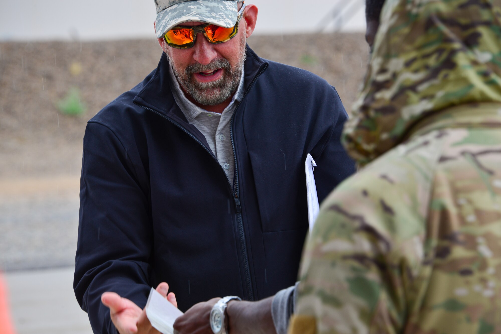 Man demonstrates the use of an absorbent blanket at Kirtland, AFB.