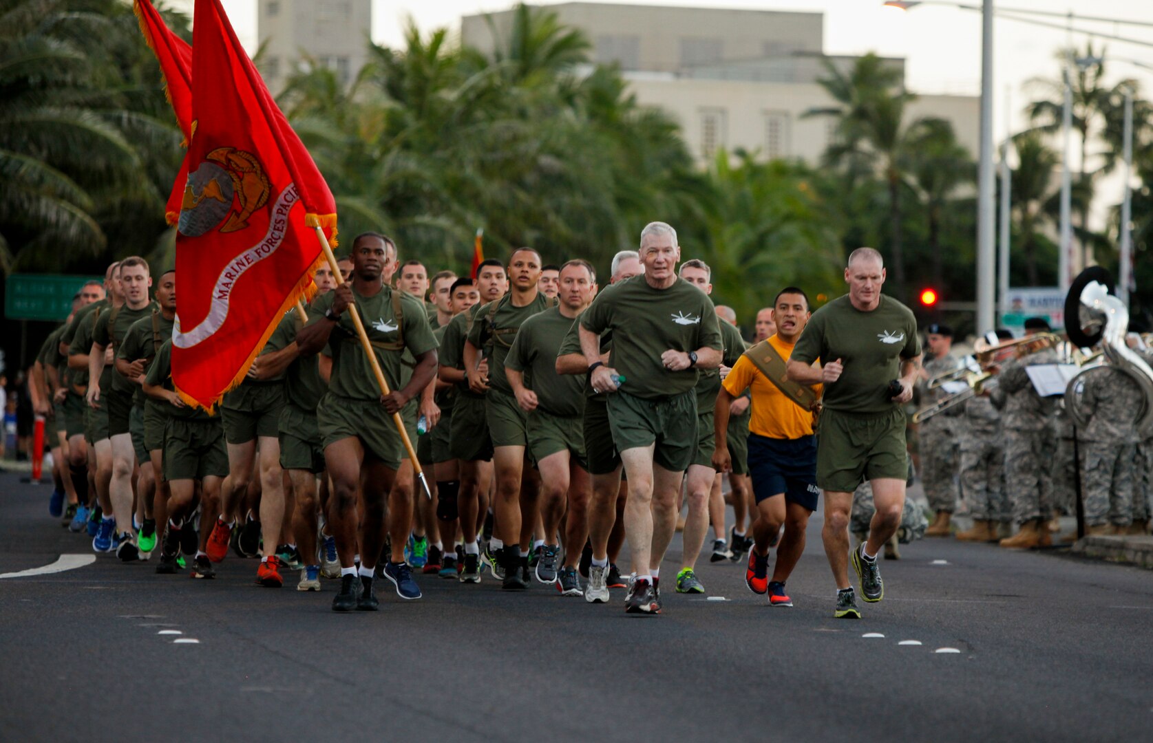 U.S. Marine Corps Lt. Gen. John A. Toolan, commander, U.S. Marine Corps Forces, Pacific, and Sgt. Maj. Paul G. McKenna, force sergeant major, lead a formation with Marines from U.S. Marine Corps Forces, Pacific and Marine Corps Base Hawaii in the Great Aloha Run in Honolulu, Hawaii, Feb. 15, 2016.