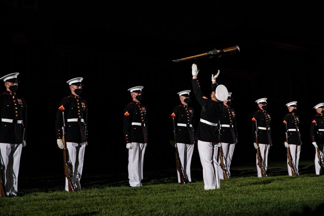 Marine Corps Silent Drill Platoon perform in the dark.