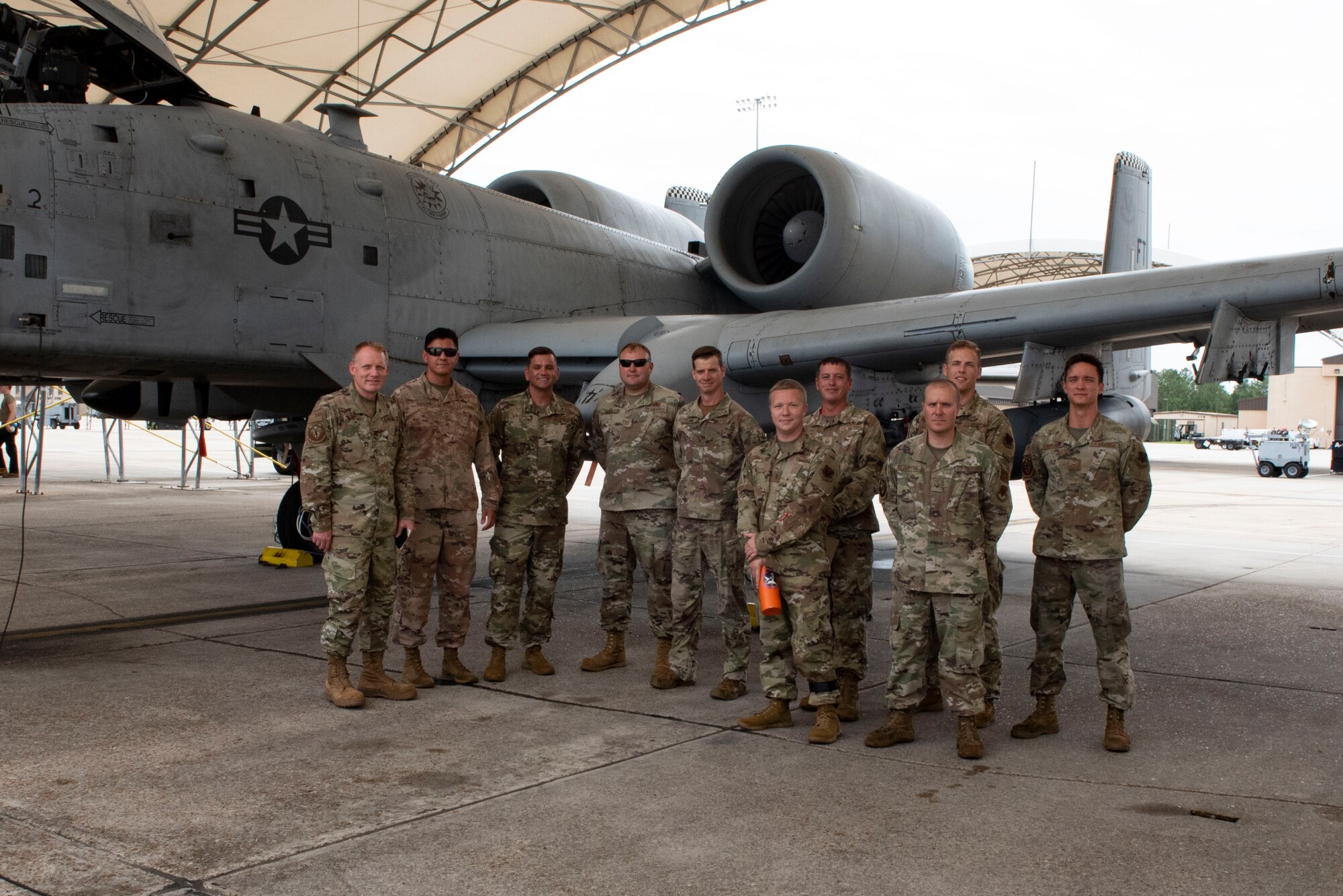 A photo of Airmen posing for a group photo.
