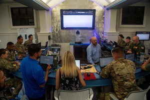 Airmen from Joint Base Charleston’s innovation lab, Palmetto Spark, learn about robitic process automation (RPA) at Joint base Charleston, S.C., June 22, 2021.