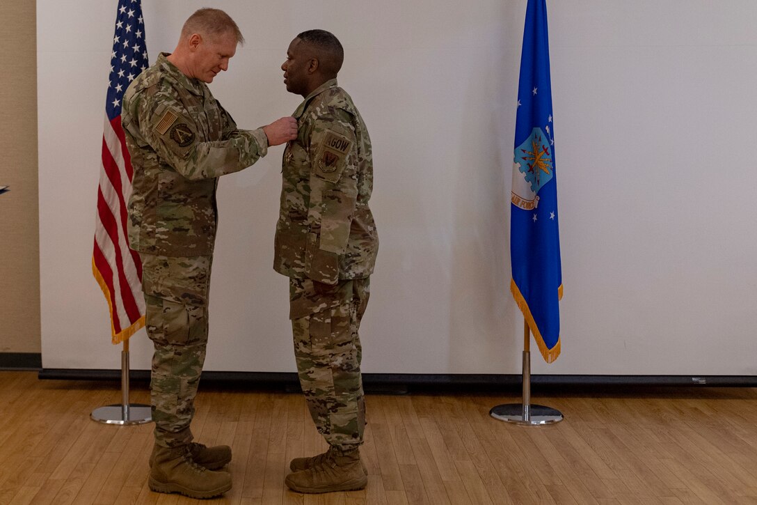 Photo of an Airman receiving a Legion of Merit medal