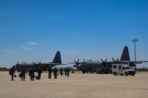 A photo of two aircraft sitting on the flight line