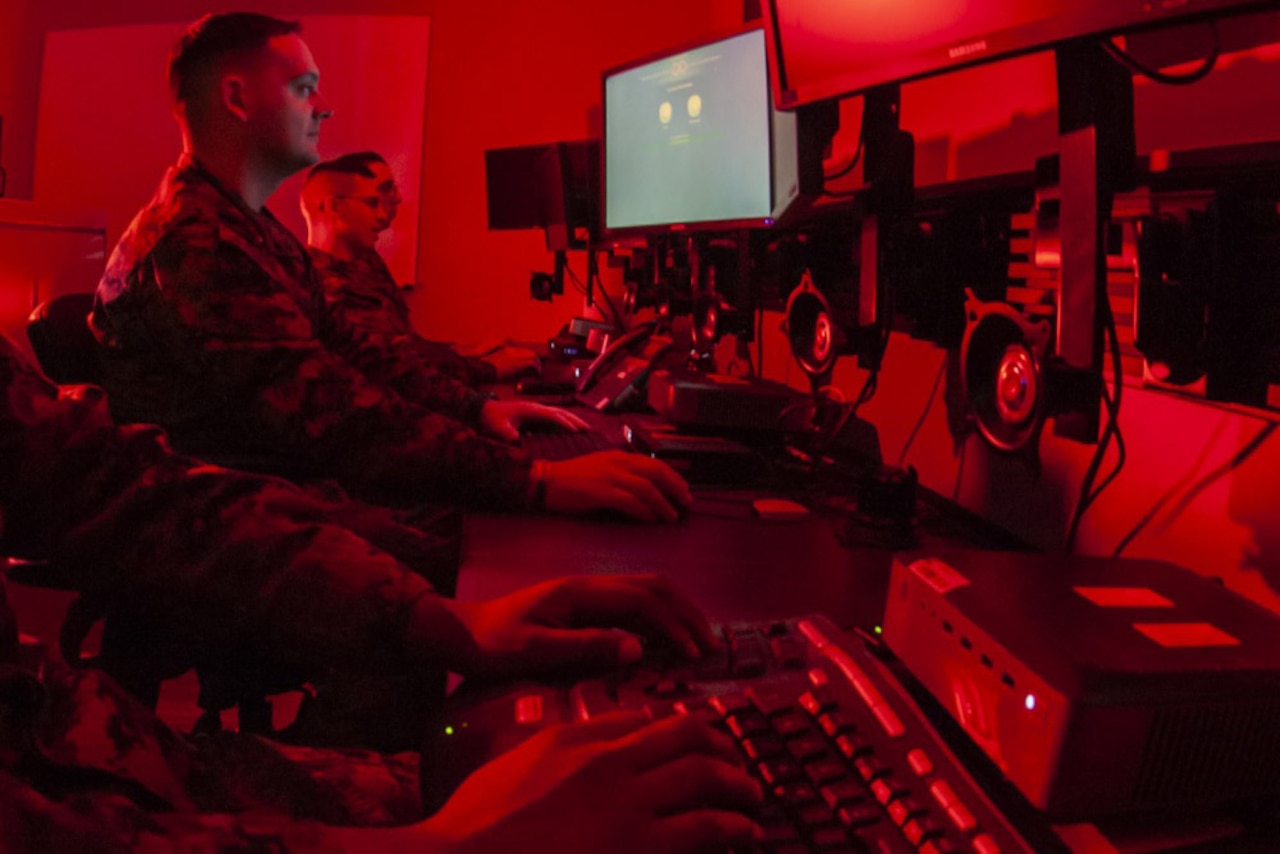 Marines in a cyber operations room.