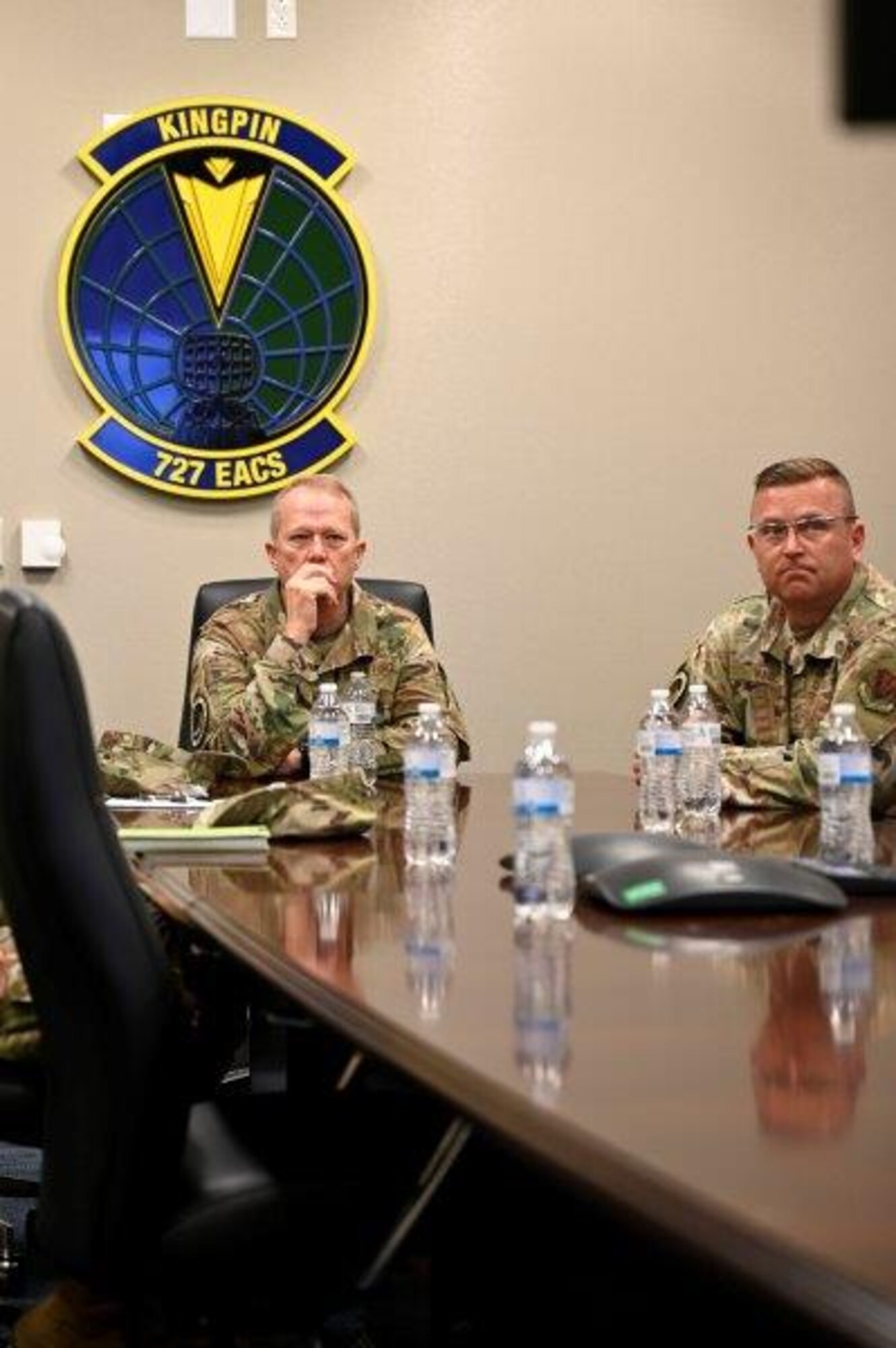 U.S. Air Force Gen. Mark Kelly (left), commander of Air Combat Command, and Chief Master Sgt. David Wade (right), Command Chief of Air Combat Command, listens to a brief from the 727th Expeditionary Air Control Squadron “Kingpin” during a base tour at Shaw Air Force Base, South Carolina, June 25, 2021. Shaw Air Force Base leadership, to include 9th Air Force (AFCENT) commander, Lt. Gen. Greg Guillot, hosted Gen. Mark Kelly on base Friday, June 26. In addition to meeting with Airmen, the generals discussed future plans at Shaw, to include building resiliency of 9th Air Force (AFCENT). The first of these plans was realized this past spring with the current repositioning of the Kingpin mission –and the more than 150 Airmen and coalition partners who support it –from the Middle East to Sumter.