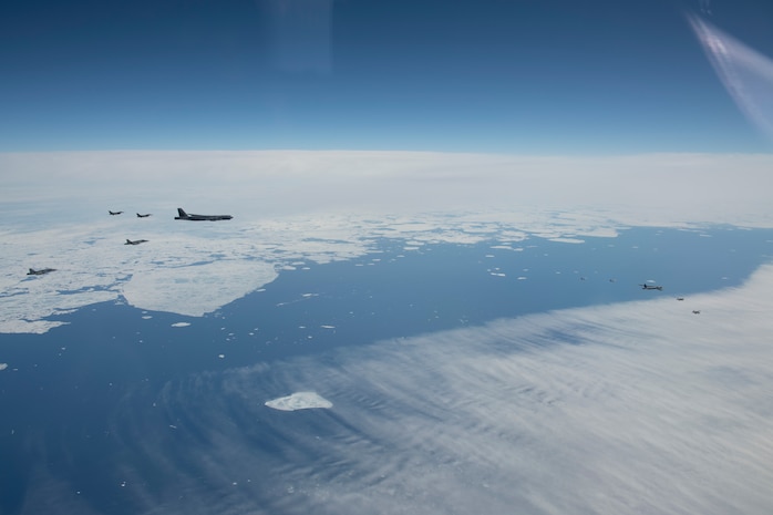 Royal Canadian Air Force CF-18 Hornet, United States Air Force F-16 Fighting Falcon, and United States Air Force F-22 Raptor fight jets fly in formation with two United States Air Force B-52 Stratofortress over Alaska, during Exercise Amalgam Dart 21-1, June 15, 2021.