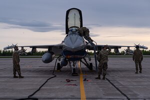 U.S. Air Force aircraft maintenance technicians from the 140th Wing, Colorado Air National Guard, prepare a United States Air Force F-16 fighter jet, for a joint mission during NORAD Exercise Amalgam Dart at 5 Wing Goose Bay, Newfoundland and Labrador, June 15, 2021.