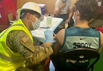Virginia National Guard Soldiers conduct a mobile vaccination mission on board international ships in May and June 2021 in Norfolk, Virginia.