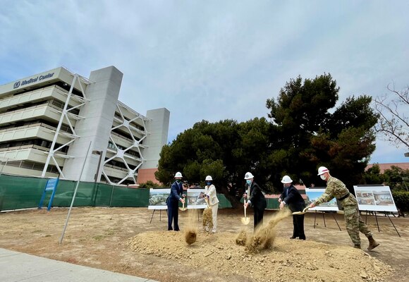 Representatives of the U.S. Army Corps of Engineers, the Department of Veterans Affairs, the Paralyzed Veterans of America and contractors gather June 16, 2021, at the San Diego Veterans Affairs Medical Center campus to break ground on the new Spinal Cord Injury/Community Living Center.