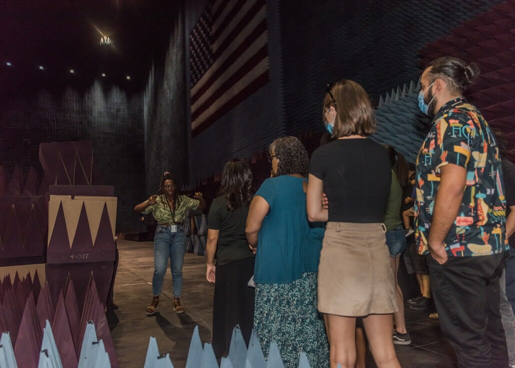 Amarachi Egbuziem-Ciolkosz, an engineer with the 772nd Test Squadron, 412th Electronic Warfare Group, provides a tour of the Benefield Anechoic Facility during the 412th EWG Family Day at Edwards Air Force Base, California, June 18. (Air Force photo by Bryce Bennett)
