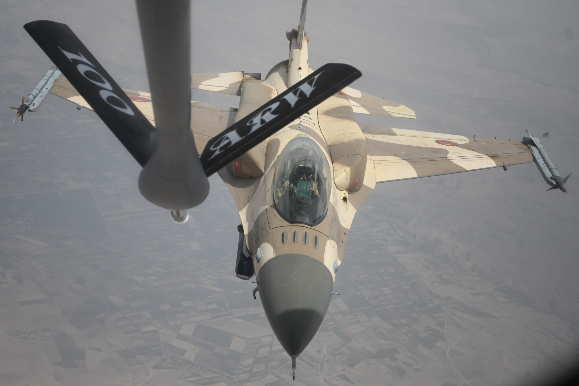 A Royal Moroccan Air Force F-16 Fighting Falcon aircraft departs from a U.S. Air Force KC-135 Stratotanker aircraft after refueling over Morocco during Exercise African Lion 2021, June 15, 2021. Air refueling with our partners increases the range and effectiveness of our aircraft, strengthening our multi-national force.



African Lion is U.S. Africa Command's largest, premier, joint, annual exercise hosted by Morocco, Tunisia and Senegal, 7-18 June. More than 7,000 participants from nine nations and NATO train together with a focus on enhancing readiness for U.S. and partner nation forces. African Lion is a multi-domain, multi-component, and multi-national exercise, which employs a full array of mission capabilities with the goal to strengthen interoperability among participants. (U.S. Air Force photo by Senior Airman Joseph Barron)