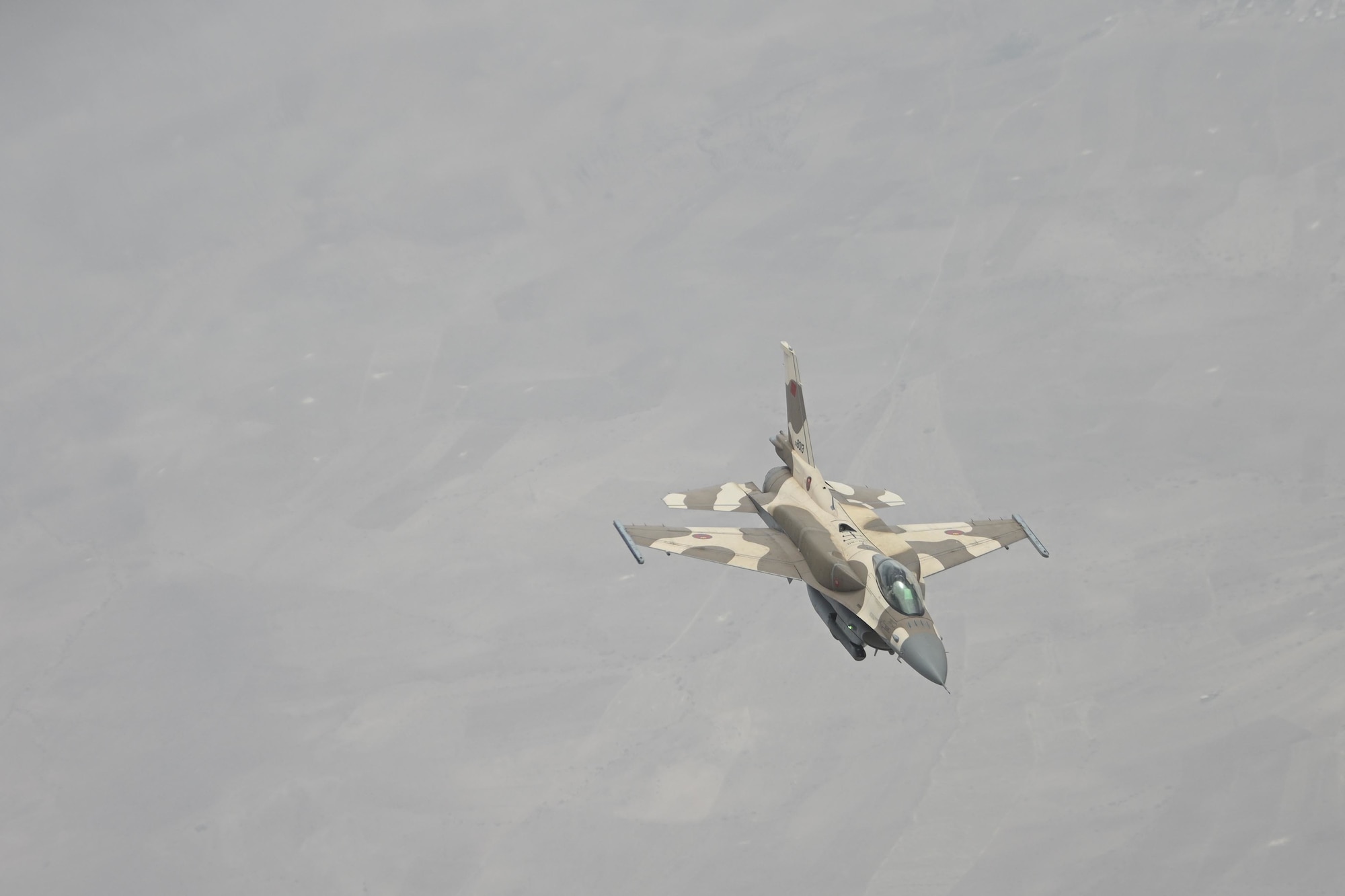 A Royal Moroccan Air Force F-16 Fighting Falcon aircraft flies over Morocco during Exercise African Lion 2021, June 15, 2021. African Lion enhances cooperation on regional security through large-force training exercises that enhance interoperability. 



African Lion is U.S. Africa Command's largest, premier, joint, annual exercise hosted by Morocco, Tunisia and Senegal, 7-18 June. More than 7,000 participants from nine nations and NATO train together with a focus on enhancing readiness for U.S. and partner nation forces. African Lion is a multi-domain, multi-component, and multi-national exercise, which employs a full array of mission capabilities with the goal to strengthen interoperability among participants. (U.S. Air Force photo by Senior Airman Joseph Barron)