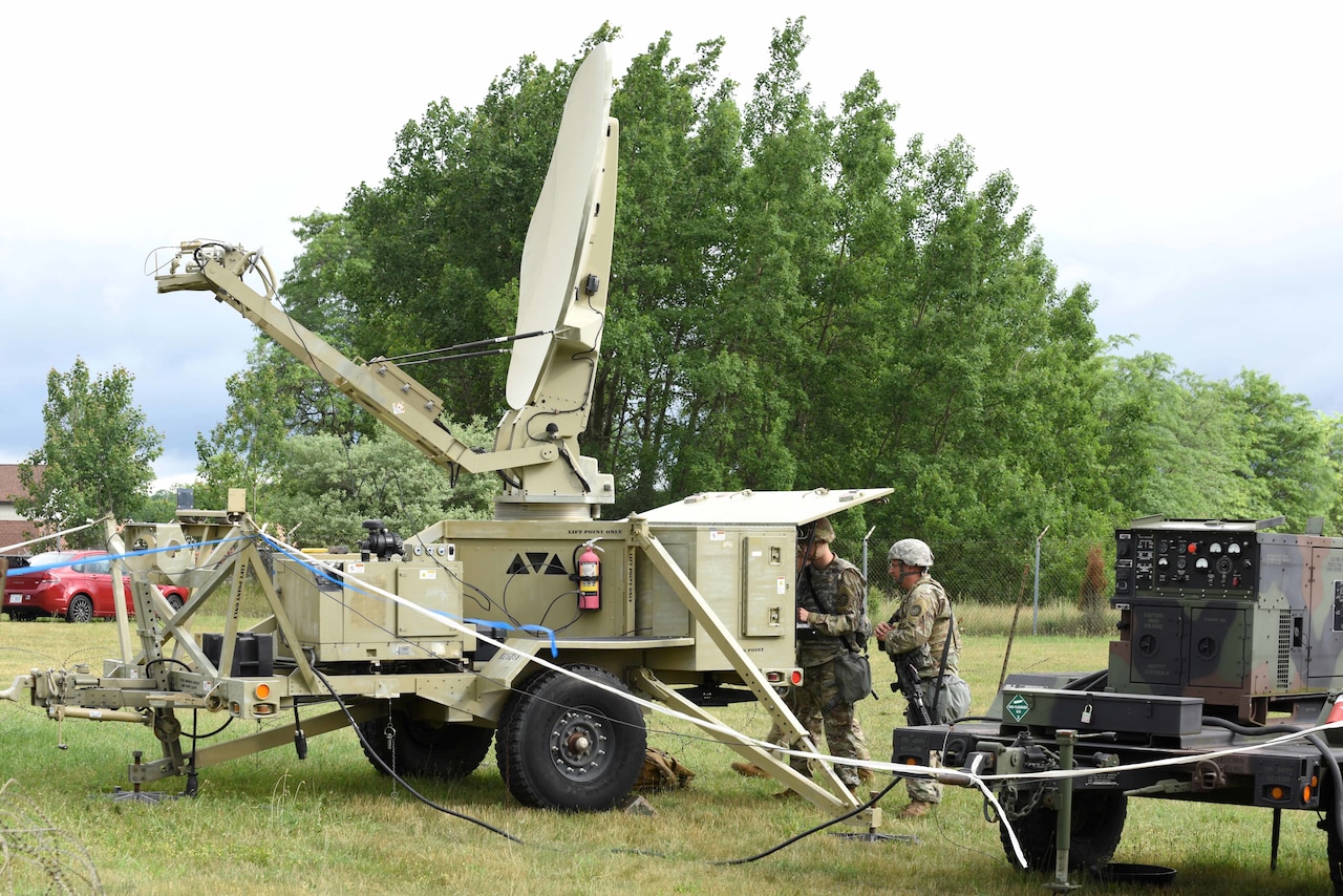 Soldiers set up a communications system.