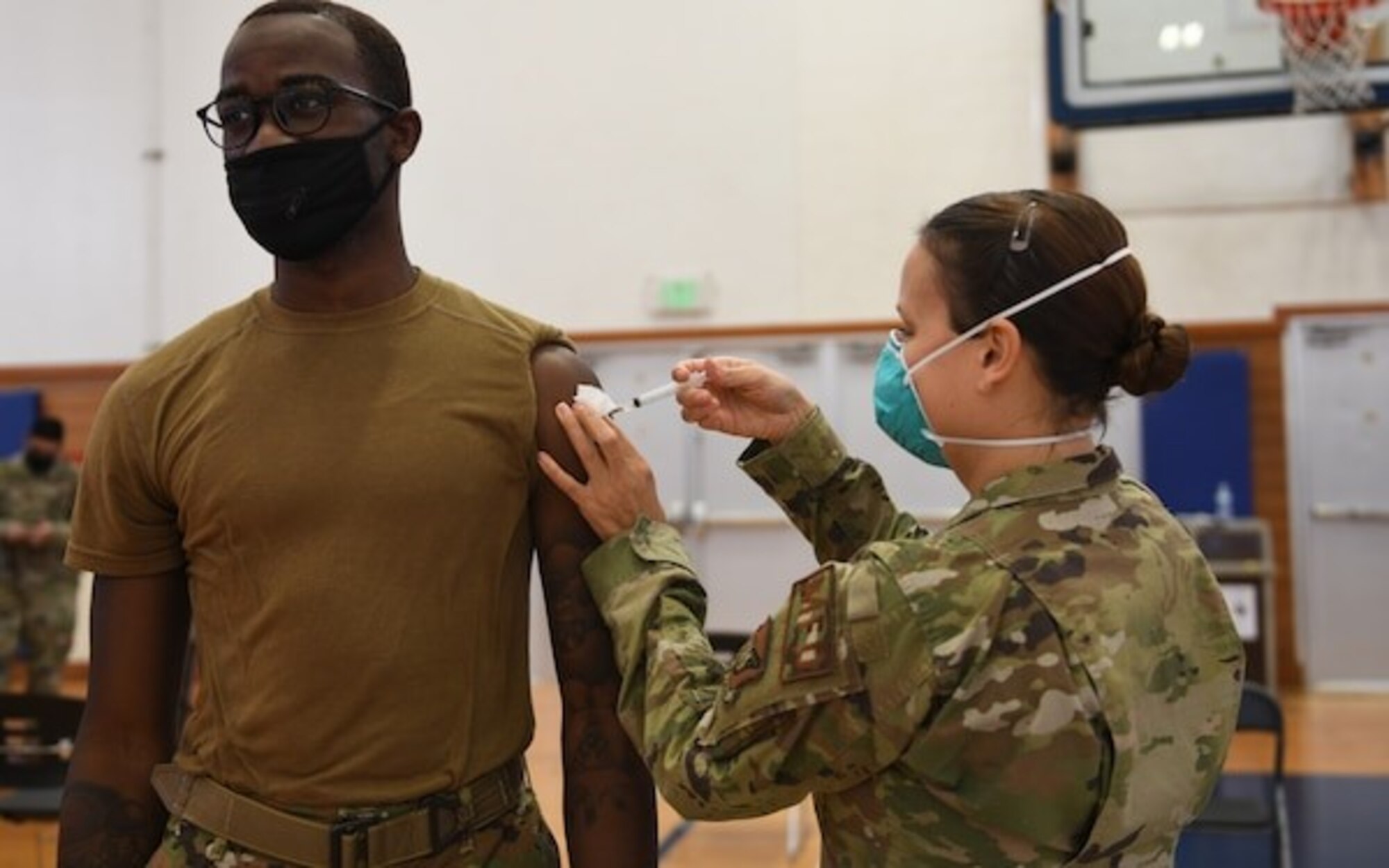 Photo of Airman receiving vaccine