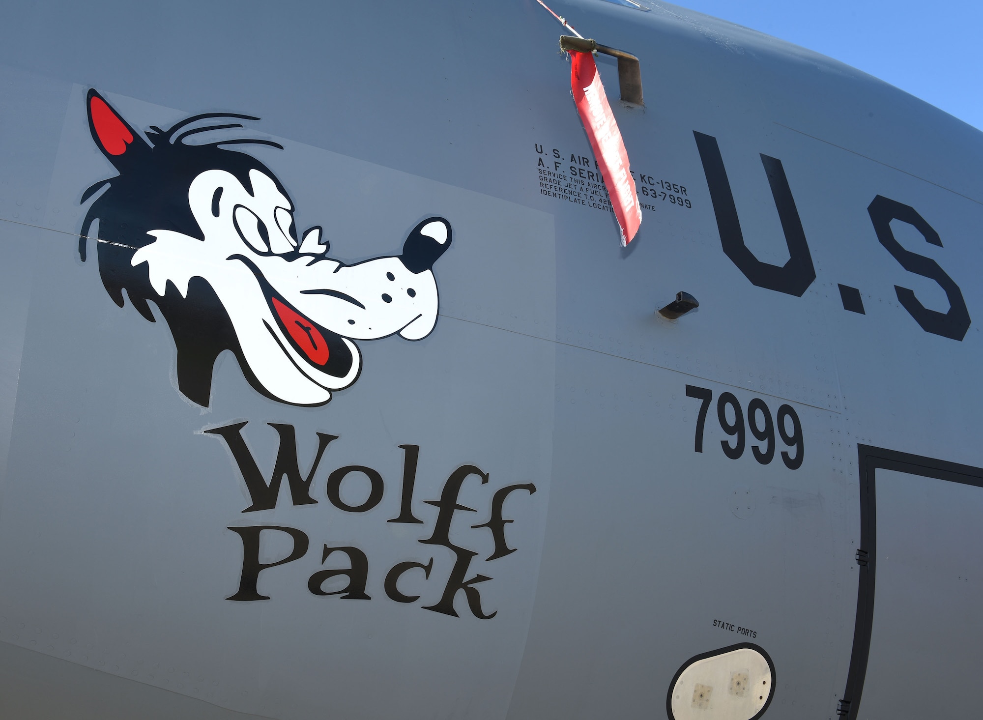 Heritage nose art “Wolff Pack” is displayed on one of the 100th Air Refueling Wing’s KC-15 Stratotanker aircraft at Royal Air Force Mildenhall Feb. 26, 2021. The nose art is based on World War II designs of the 100th Bombardment Group based at Thorpe Abbotts, Diss, England. Lieutenant Robert Wolff was a B-17 Flying Fortress pilot with the 418th Bomb Squadron, 100th BG, who flew his first combat mission out of Thorpe Abbotts. The KC-135 nose art was dedicated to Wolff in May 2012, on the 67th anniversary of Victory in Europe Day. The Wolff Pack tanker has been sponsored by the 100th Operations Support Squadron as part of RAF Mildenhall’s new “Adopt-a-Jet” program. (U.S. Air Force photo by Karen Abeyasekere)